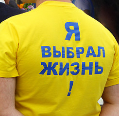 Image showing Men's knitted t-shirt with an optimistic inscription on the back