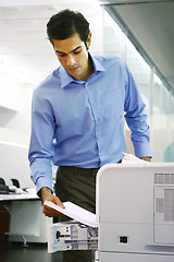 Image showing worker using a copy machine