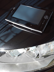 Image showing Black net-book on car l