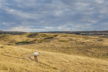 Image showing moutain biking in a rolling prairie