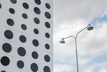 Image showing Building with round windows and streetlights