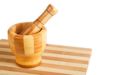 Image showing Mortar and pestle on a cutting board