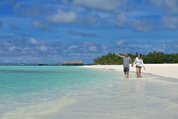 Image showing happy young couple have fun on beach