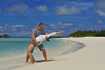 Image showing happy young couple have fun on beach