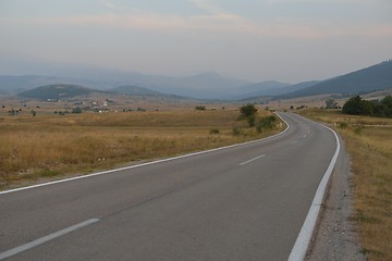 Image showing road through the green field