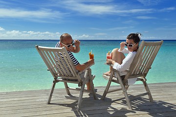 Image showing happy young couple relax and take fresh drink