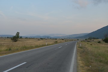 Image showing road through the green field