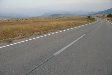 Image showing road through the green field