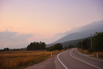 Image showing road through the green field