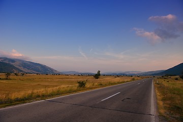 Image showing road through the green field