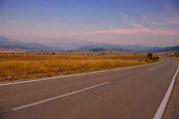 Image showing road through the green field