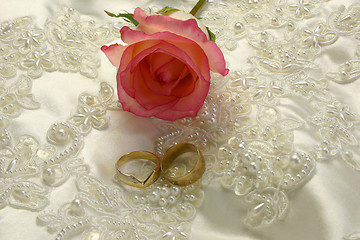 Image showing rings satin and a rose