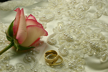Image showing rings satin and a rose
