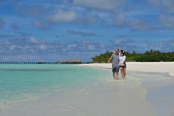 Image showing happy young couple have fun on beach