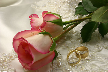 Image showing rings satin and a rose