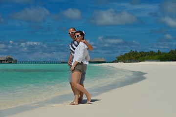 Image showing happy young couple have fun on beach