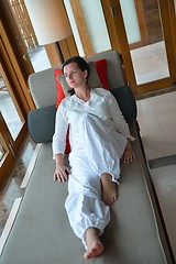 Image showing happy young woman relax at home on sofa