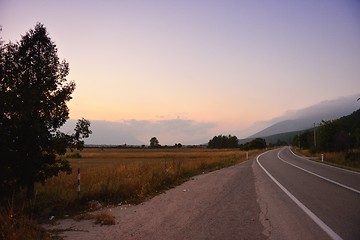 Image showing road through the green field