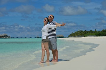 Image showing happy young couple have fun on beach