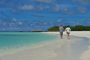 Image showing happy young couple have fun on beach