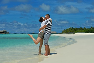 Image showing happy young couple have fun on beach