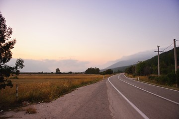 Image showing road through the green field