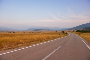 Image showing road through the green field