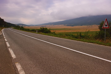 Image showing road through the green field