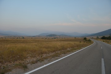 Image showing road through the green field