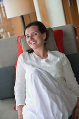 Image showing happy young woman relax at home on sofa