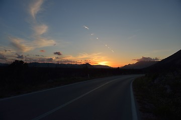 Image showing road through the green field