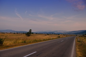 Image showing road through the green field