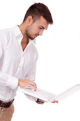 Image showing young adult business man and notebook isolated 