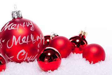 Image showing christmas decoration festive red bauble in snow isolated