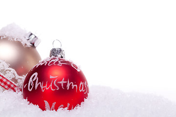 Image showing christmas decoration festive red bauble in snow isolated