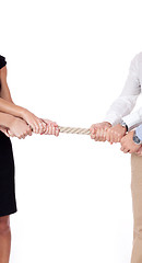 Image showing business woman against businessman pulling rope isolated