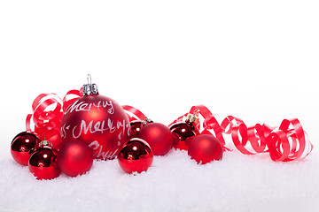 Image showing christmas decoration festive red bauble in snow isolated