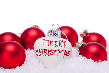 Image showing christmas decoration festive red bauble in snow isolated