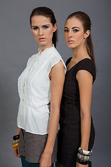 Image showing two beutiful brunette girls in casual fashion and accessory 