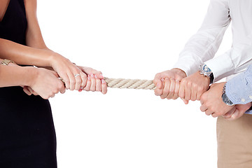 Image showing business woman against businessman pulling rope isolated