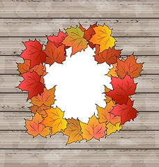 Image showing Autumn leaves maple with copy space, wooden texture