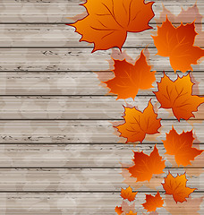 Image showing Autumn leaves maple on wooden texture