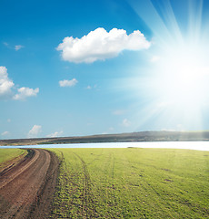 Image showing dirty way to horizon under sun and clouds