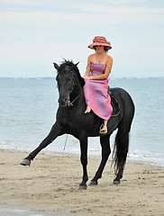 Image showing girl and  horse on the beach