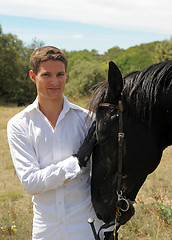 Image showing young man and horse