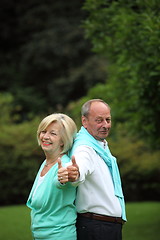 Image showing Enthusiastic senior couple giving a thumbs up