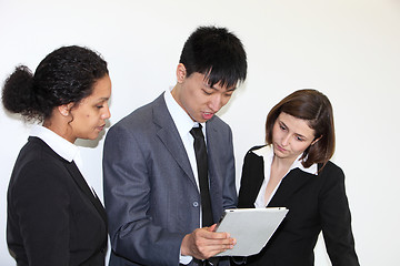 Image showing Business colleaues consulting a tablet-pc