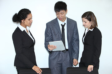 Image showing Multiethnic coworkers discussing a problem