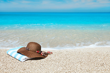 Image showing Hat and towel on a beach