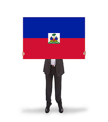 Image showing Businessman holding a big card, flag of Haiti